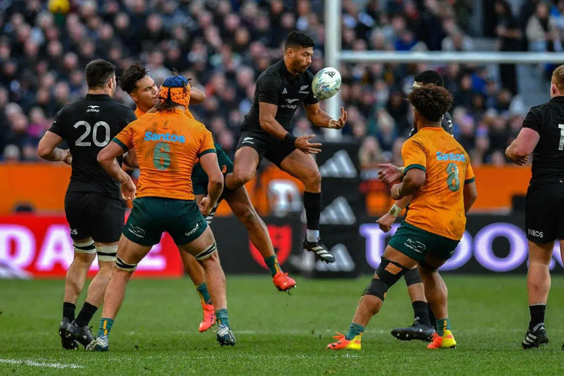 New Zealand's Richie Mo’unga catches the ball during the clash against Australia on Aug 5, 2023.