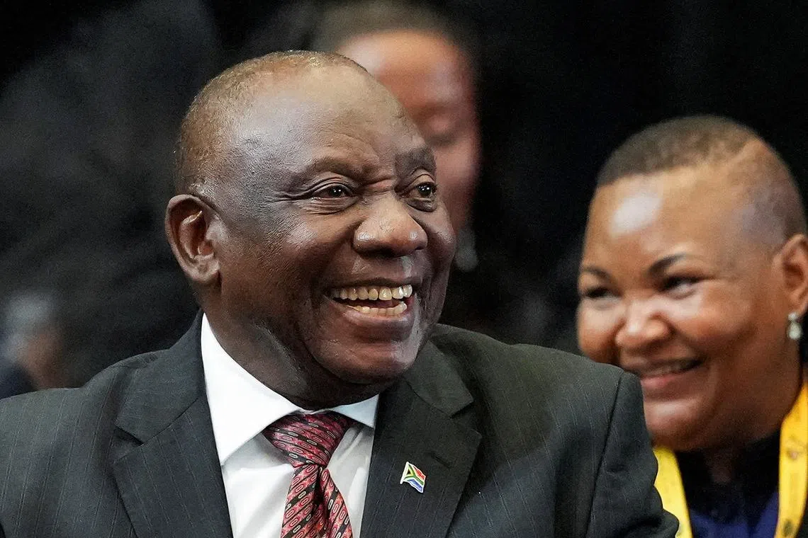FILE PHOTO: South African president Cyril Ramaphosa reacts after being re-elected as president of South Africa during the first sitting of the National Assembly following elections at the Cape Town International Convention Center (CTICC) in Cape Town, South Africa June 14, 2024. REUTERS/Nic Bothma/File Photo