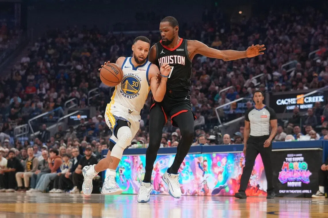 The Golden State Warriors' Stephen Curry attempting to dribble past Kevin Durant of the Houston Rockets during the Warriors' 117-116 NBA home loss on April 5.