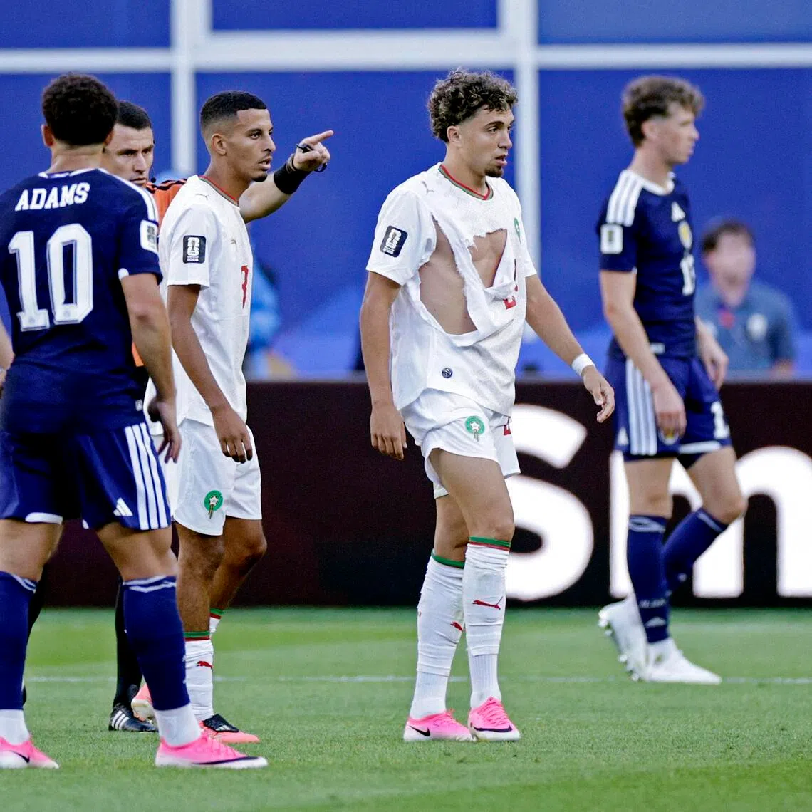 Morocco's Neil El Aynaoui in his torn jersey during a match against Scotland on June 19.