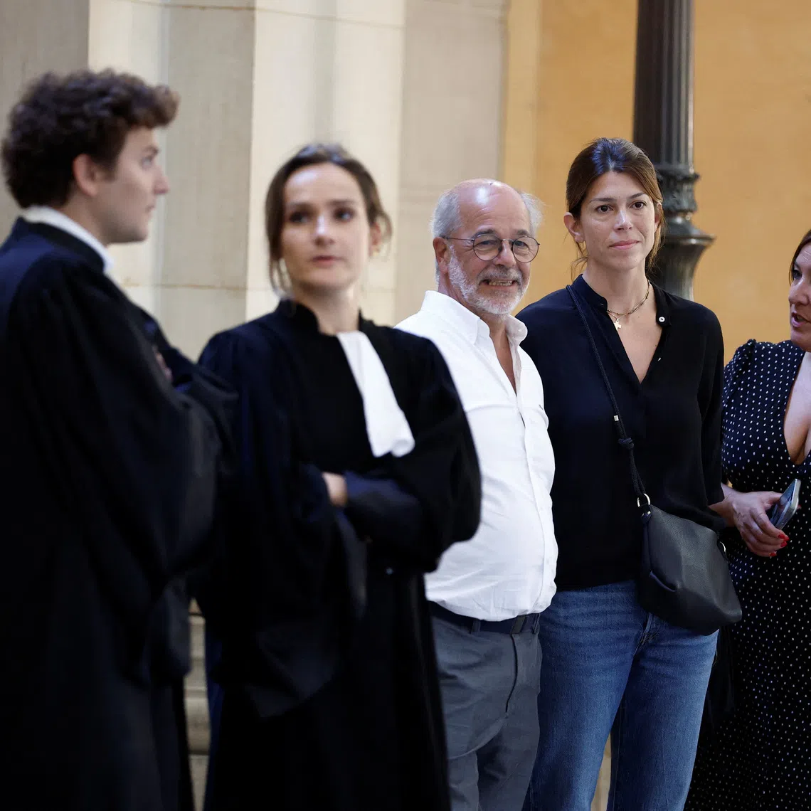 Maria Aramburu, widow of former Argentine rugby international Federico Martin Aramburu, former rugby player Shaun Hegarty and lawyers arrive for the trial of far-right activists Loik Le Priol and Romain Bouvier, who are charged with murder and attempted murder over the 2022 shooting death of Federico Martin Aramburu, at the criminal court in Paris, France, September 7, 2026. REUTERS/Benoit Tessier