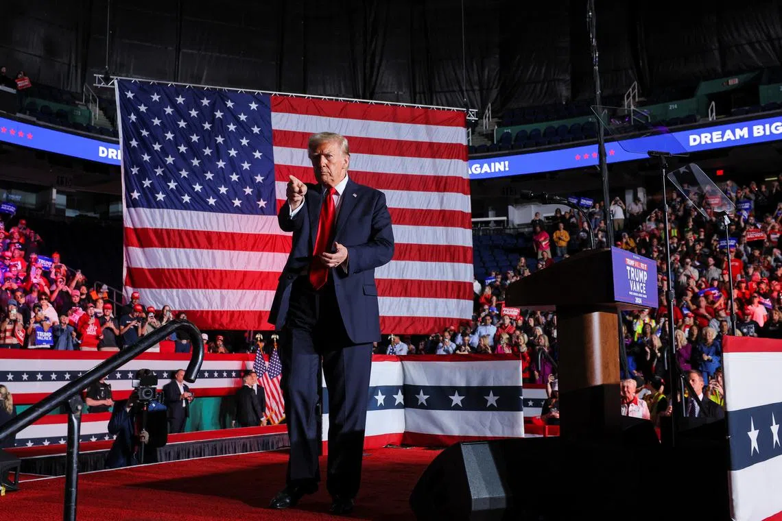 Republican presidential nominee and former U.S. President Donald Trump gestures on the day of a campaign rally in Greensboro, North Carolina, U.S. November 2, 2024. REUTERS/Brian Snyder