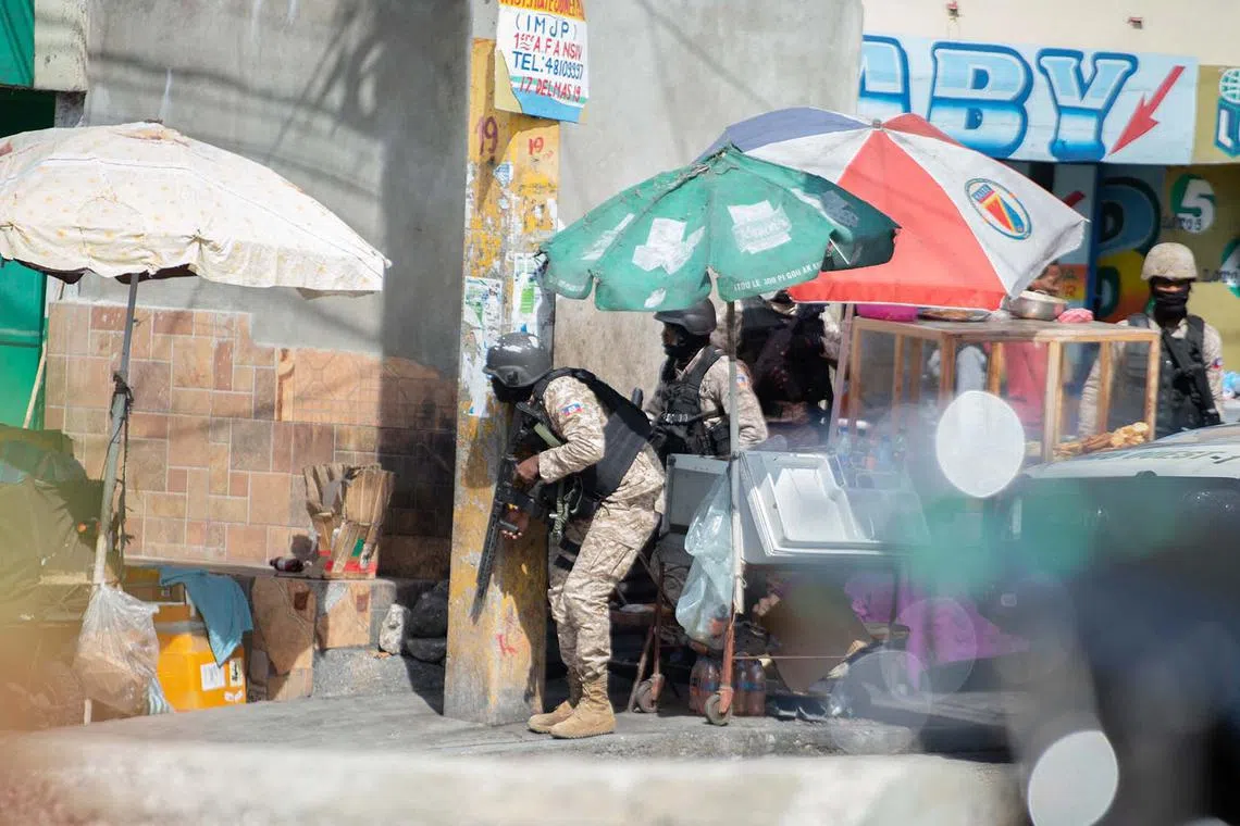 Haitian police officers exchanging gunfire with alleged gang members in Port-au-Prince on Nov 11, 2024. Alix Didier Fils-Aime was sworn in as Haiti’s new prime minister on Nov 11, promising to restore security and tackle gang violence in the crisis-wracked country. 