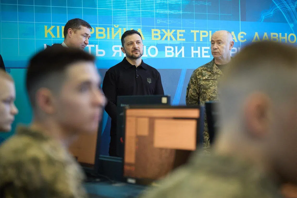 Ukrainian President Volodymyr Zelensky (centre) warned in an online briefing that Russia's leader wanted to “weaken” Ukraine and was “not ready to end this war”.