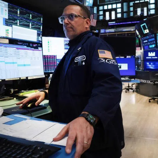 Traders work on the floor of the New York Stock Exchange on May 27, 2026, in New York City. 