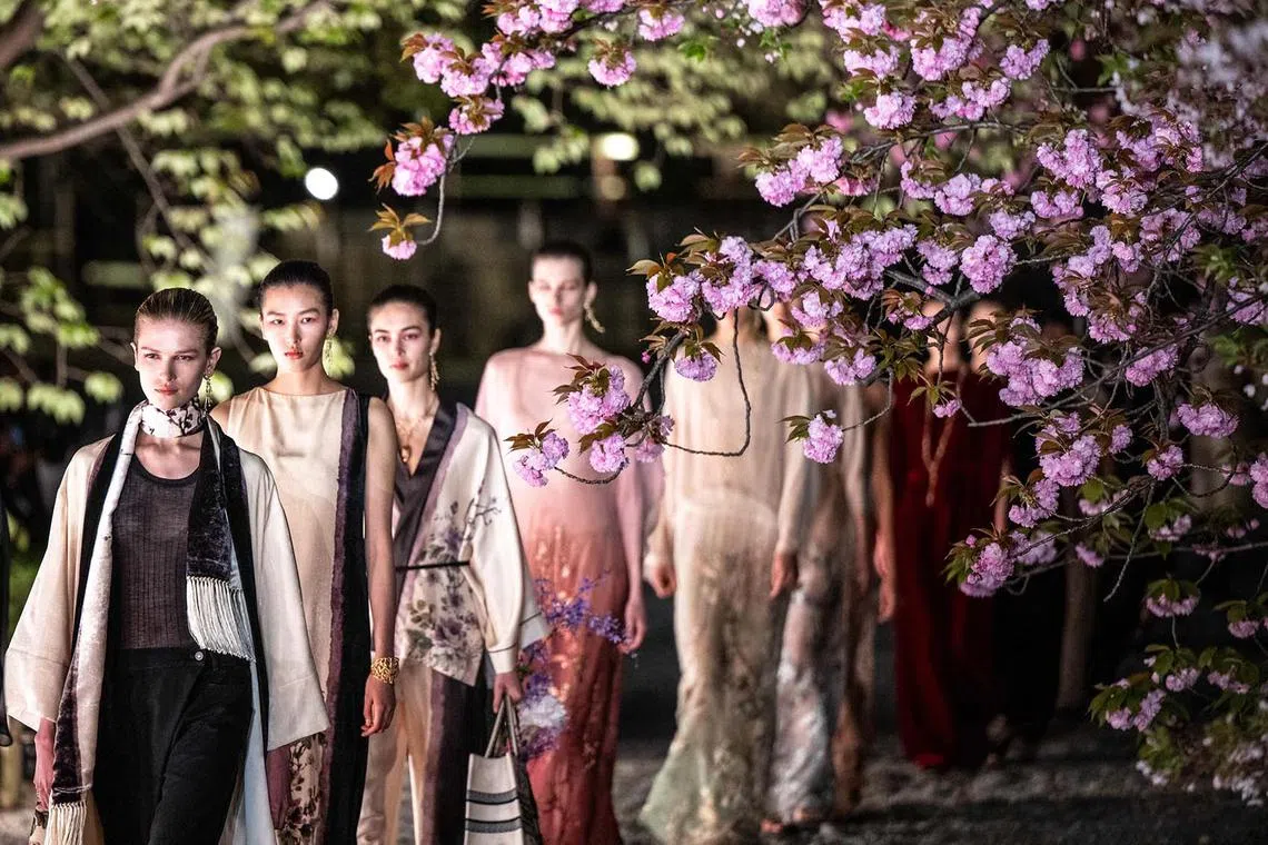 Models presenting creations by Dior for its Fall 2025 collection fashion show in Kyoto's Toji Temple on April 15, 2025. 