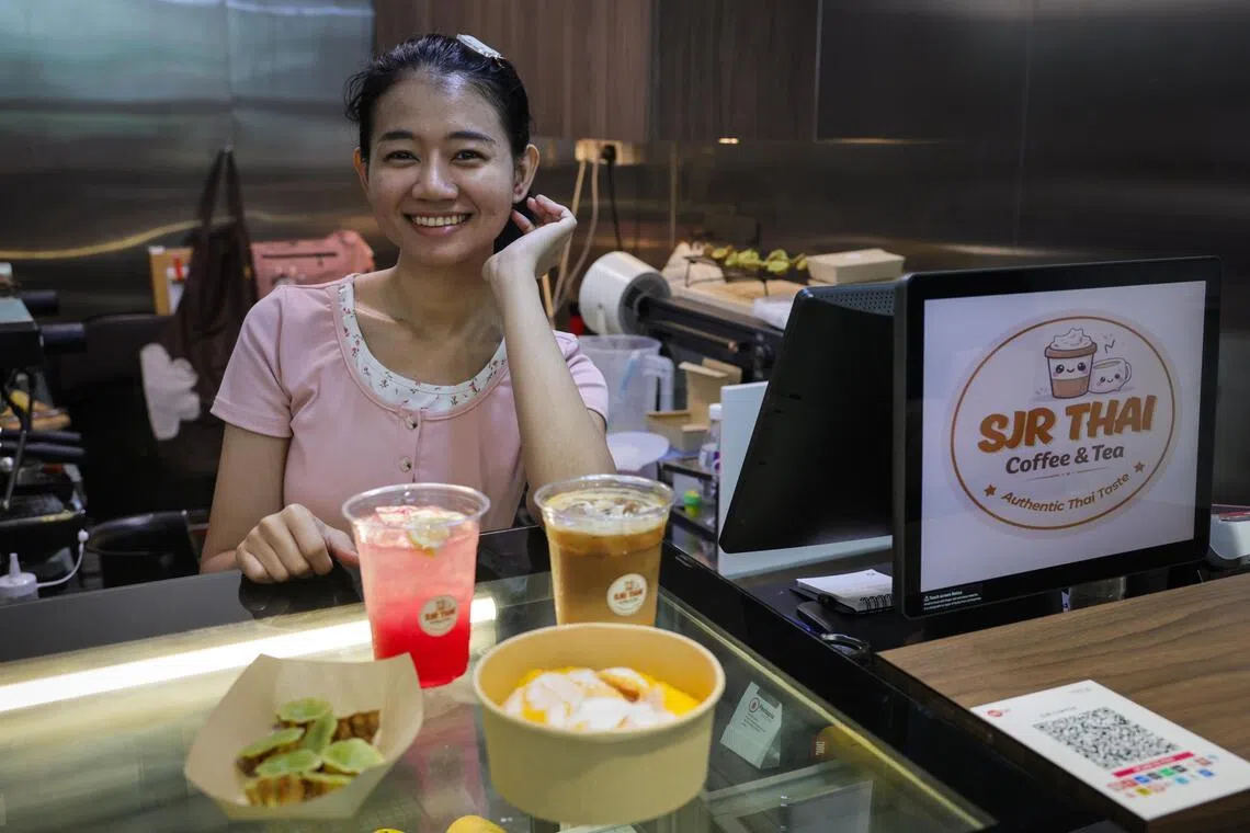 SJR Thai Coffee & Tea’s owner Sojirat Narkhruea with her Thai milk and snack bundles.