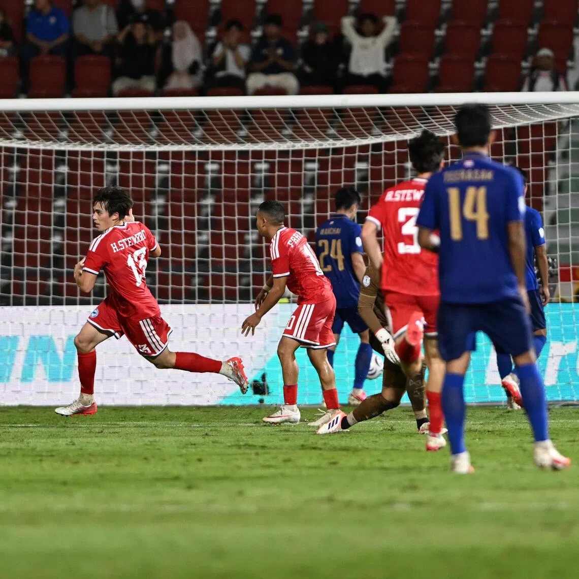Singapore’s Harhys Stewart (No. 13) celebrating his goal against Thailand at the Rajamangala Stadium in Bangkok in the second leg of their ASEAN Championship semi-final clash on Aug 18.
