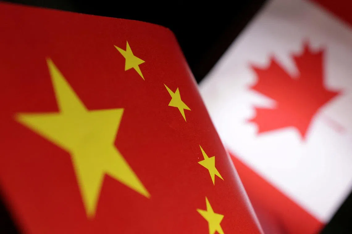 Printed Chinese and Canada flags are seen in this illustration, July 21, 2022. REUTERS/Dado Ruvic/Illustration