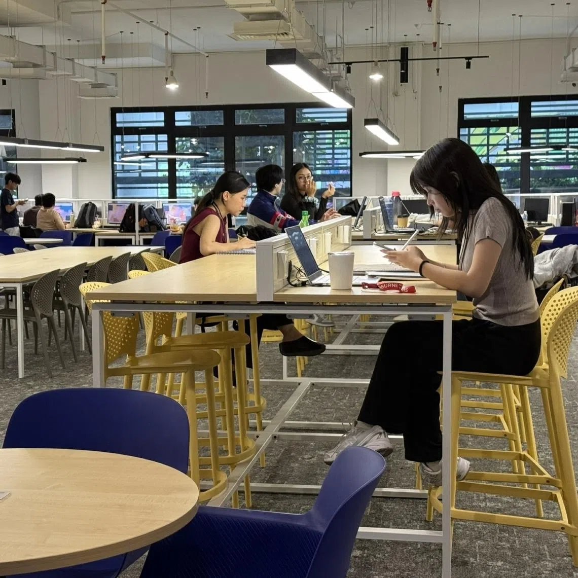 Students reading at the library of Swinburne University of Technology, Sarawak