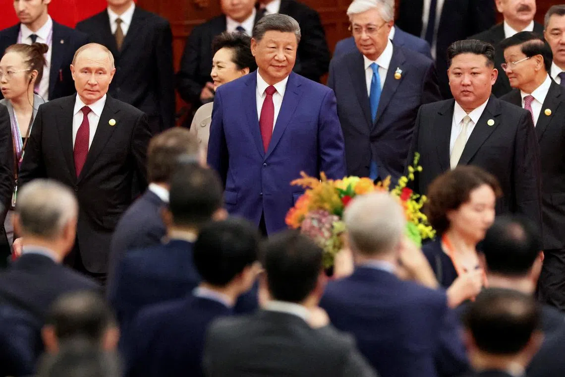 Chinese President Xi Jinping, Russian President Vladimir Putin and North Korean leader Kim Jong Un arrive for a reception marking the 80th anniversary of the end of World War Two, at the Great Hall of the People in Beijing, China September 3, 2025. REUTERS/Florence Lo