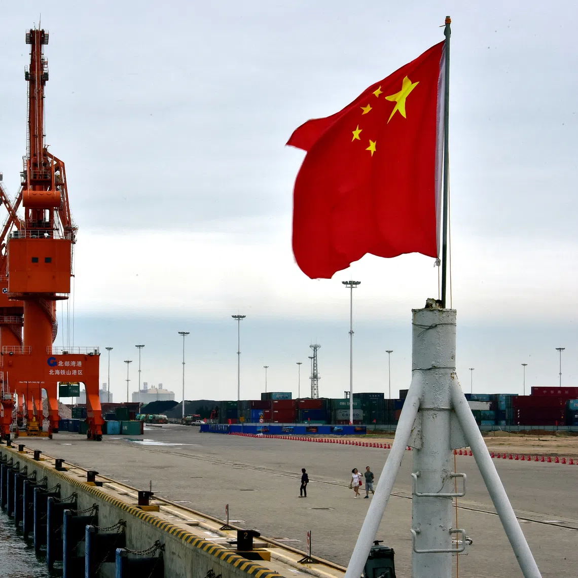 A Chinese national flag flies at a port in Beihai, Guangxi autonomous region, China June 17, 2017. Picture taken June 17, 2017. REUTERS/Stringer