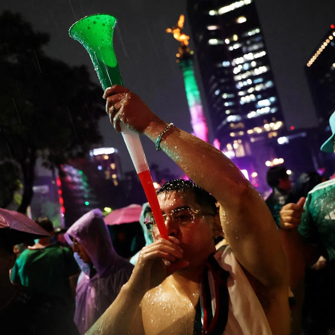 The Angel of Independence is seen as Mexico fans celebrate in the rain after the Czech Republic v Mexico match REUTERS/Luis Cortes