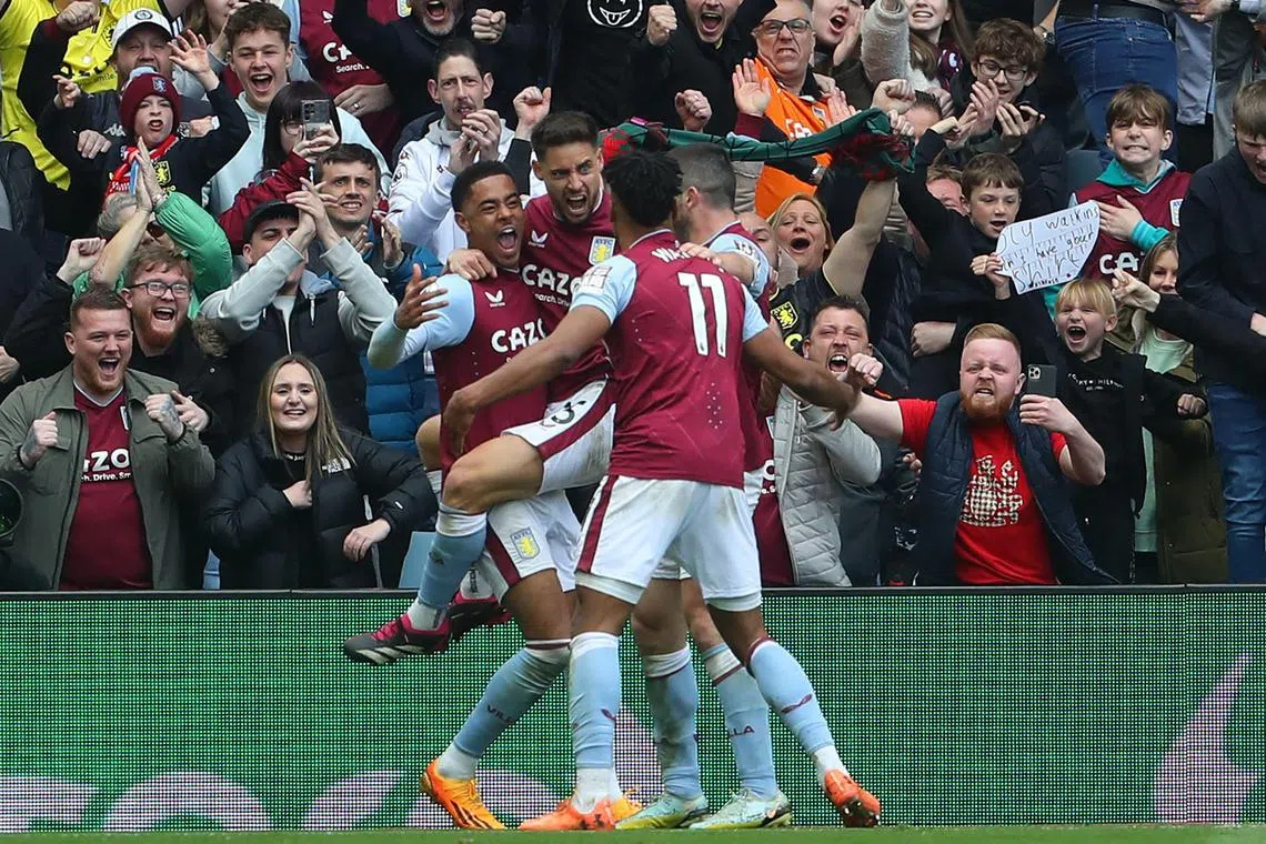 Aston Villa striker Ollie Watkins (centre) celebrates with teammates after scoring their second goal during the 3-0 win over Newcastle United.