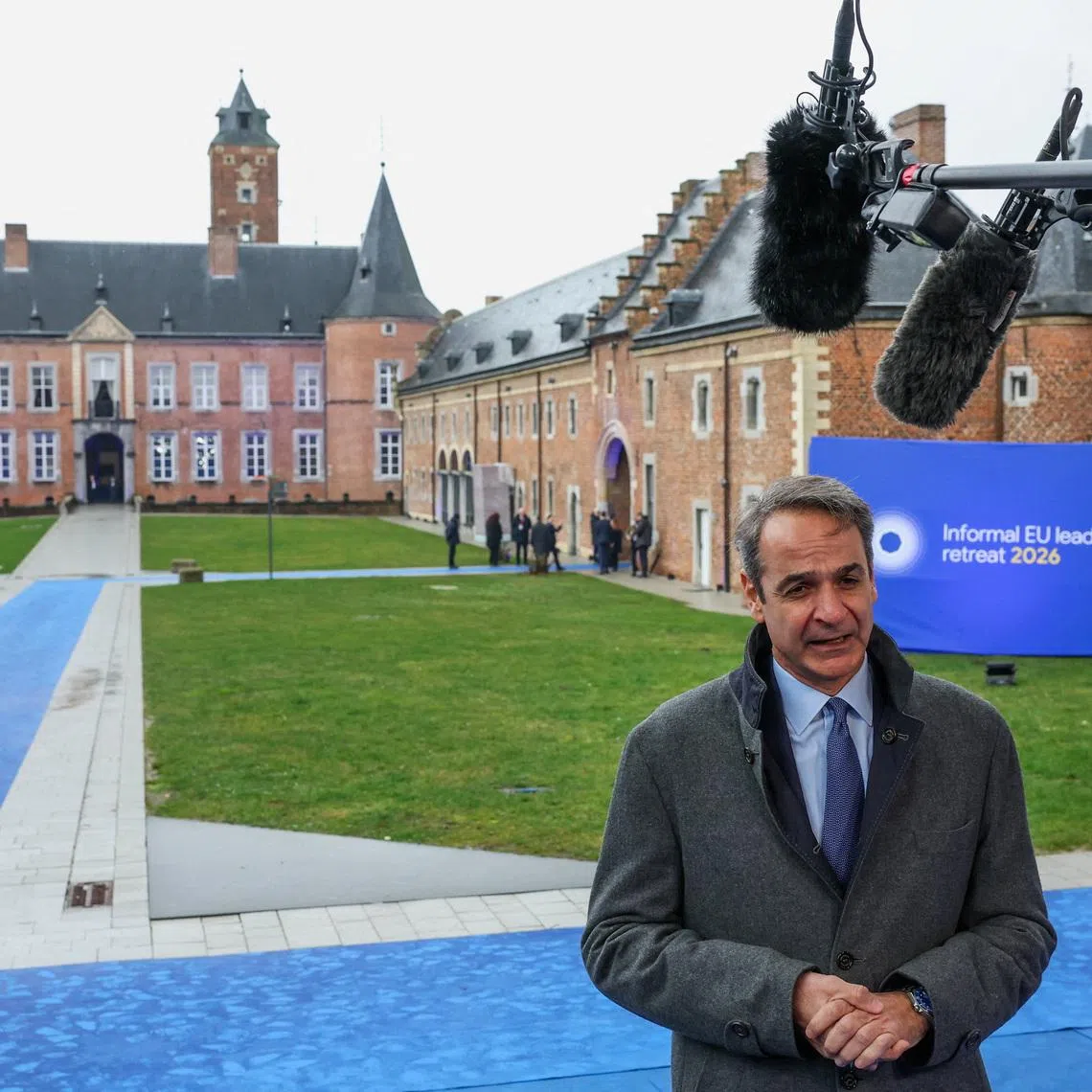 FILE PHOTO: Greece’s Prime Minister Kyriakos Mitsotakis speaks to the media at Alden Biesen castle, on the day of an informal European Union leaders retreat, Belgium, February 12, 2026. REUTERS/Murad Sezer