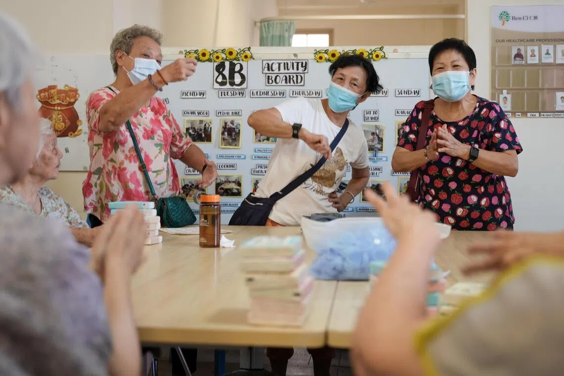Seniors from Allkin Active Ageing Centre @ Ang Mo Kio 420 dancing and singing with residents in the wards at Ren Ci @ Ang Mo Kio on Jun 26.
