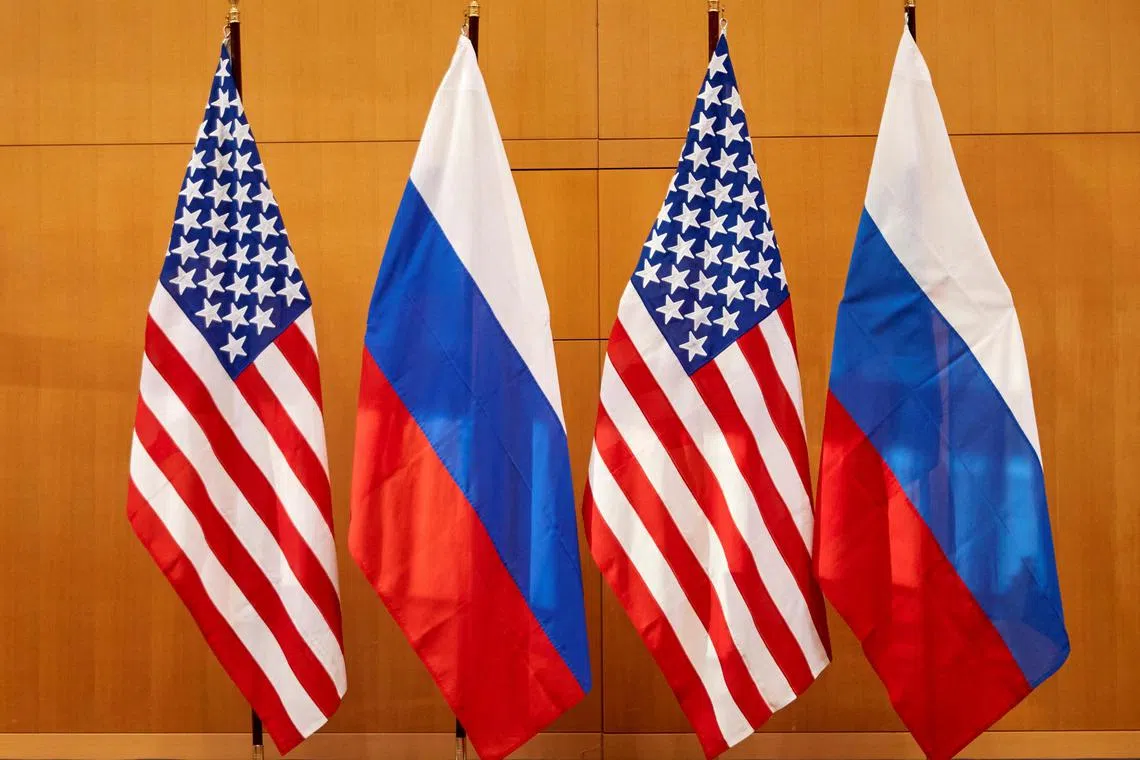 FILE PHOTO: Russian and U.S. flags are pictured before talks between Russian Deputy Foreign Minister Sergei Ryabkov and U.S. Deputy Secretary of State Wendy Sherman at the United States Mission in Geneva, Switzerland January 10, 2022. REUTERS/Denis Balibouse/File Photo