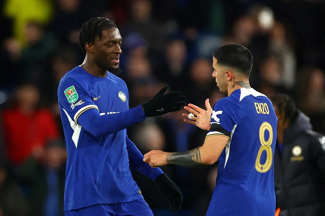 FILE PHOTO: Soccer Football - Carabao Cup - Semi-Final - Second Leg - Chelsea v Middlesbrough - Stamford Bridge, London, Britain - January 23, 2024 Chelsea's Axel Disasi shakes hands with Chelsea's Enzo Fernandez after the match Action Images via Reuters/Matthew Childs/File Photo