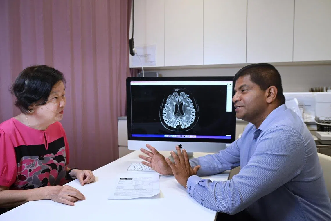 From left : Madam Connie Wong, 69 seeking consultation from Associate Prof Nagaendran Kandiah . Picture was taken at the Lee Kong Chian School of Medicine on 15 May 2023.  Asian Dementia is expected to rise in the years to come as more reah the age of 65 and above. Asians are more susceptible to getting dementia as there are proteins in the brain that cause forgetfulness and deterioration of brain tissues caused by ageing.