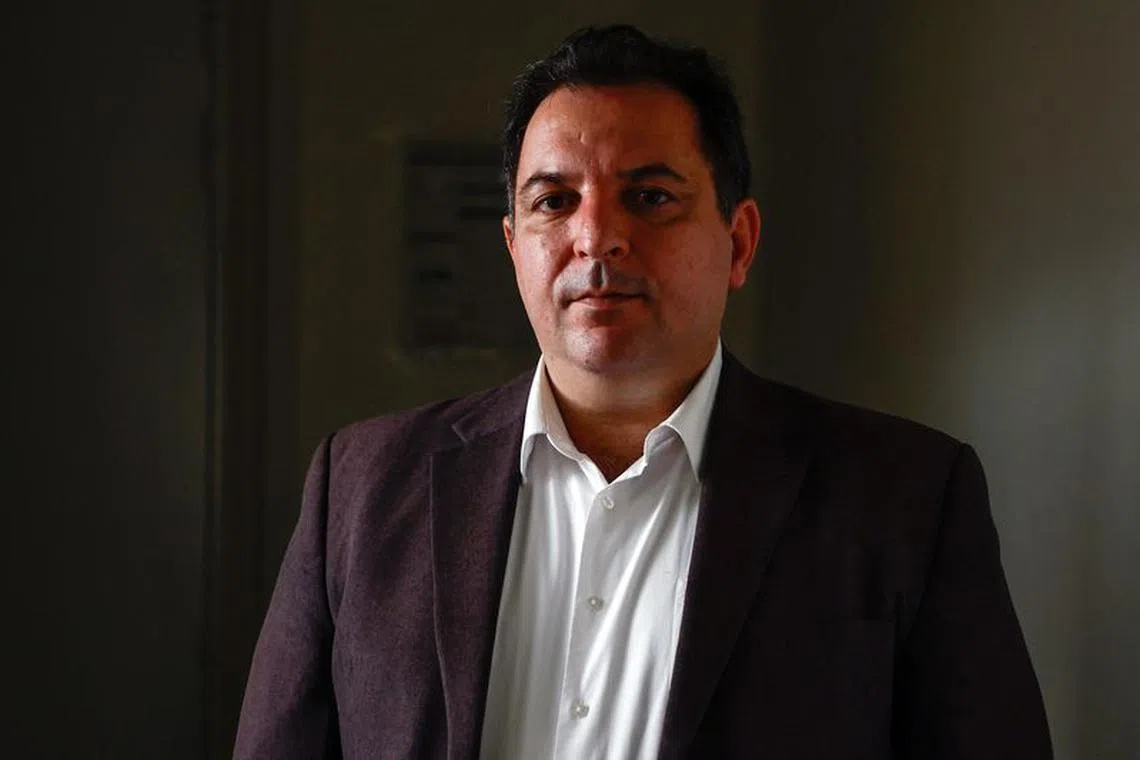 Mazen Darwish, head of the Syrian Center for Media and Freedom of Expression poses after an interview with Reuters in Paris, France, September 15, 2023. REUTERS/Gonzalo Fuentes