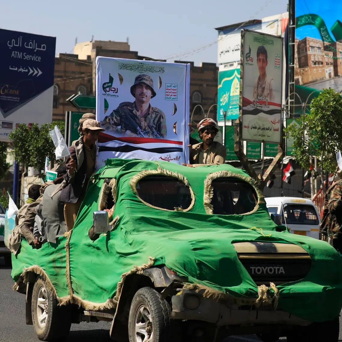 Iran-backed Houthi militants taking part in a funeral procession in Sanaa, Yemen, on Sept 24, carrying portraits and coffins of fellow fighters killed in action.