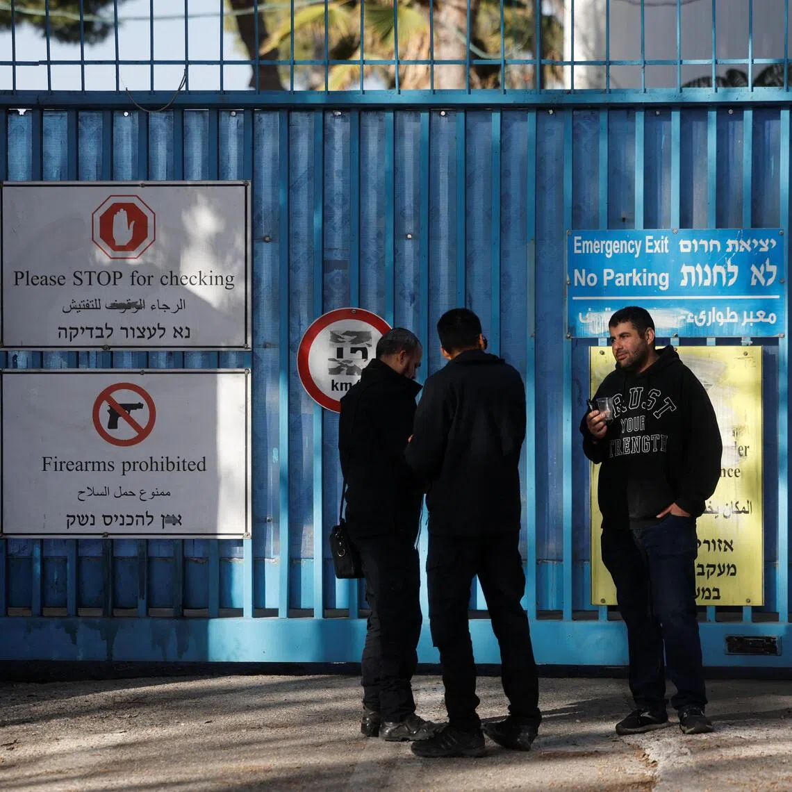 Israeli police officers wait outside the UNRWA headquarters in Jerusalem on Dec 8.