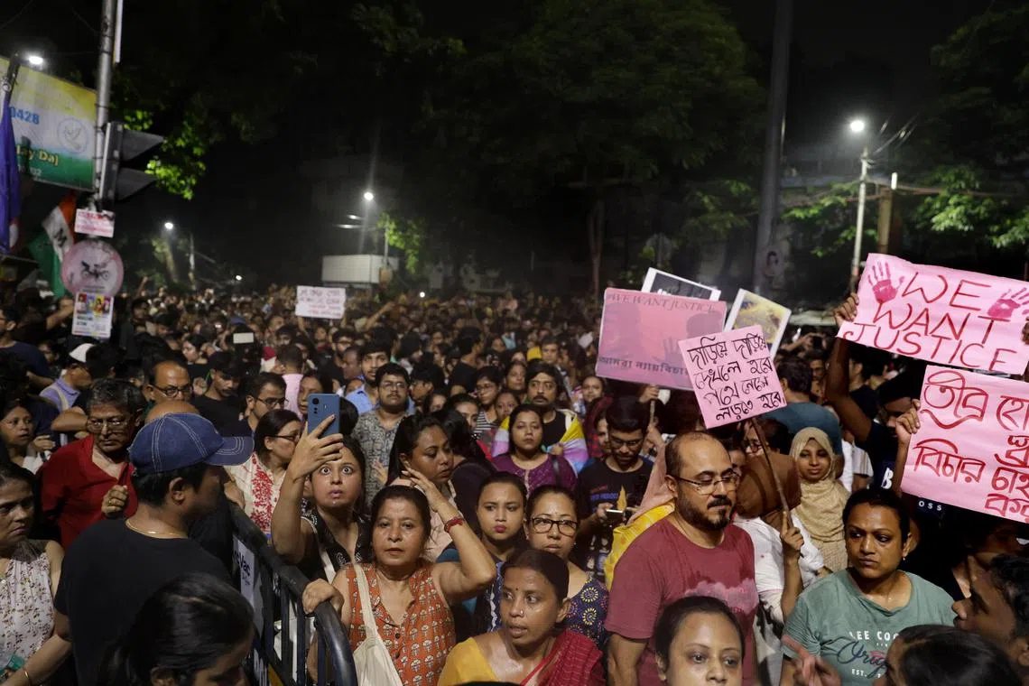 Citizens of Kolkata shout slogans against the government as they attend a mass protest over a rape and murder incident that took place at RG Kar Medical College in Kolkata, India, on Aug 14.