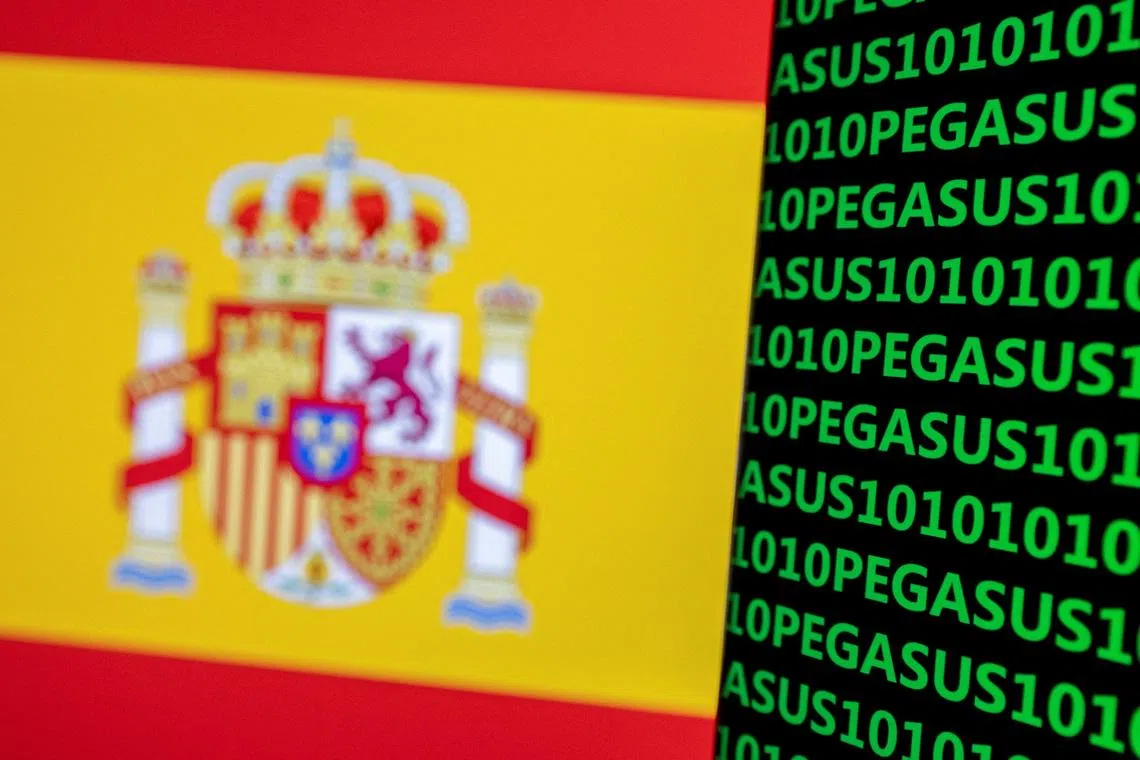 FILE PHOTO: The word Pegasus, binary code and the Spanish flag are seen in this illustration taken May 4, 2022. REUTERS/Dado Ruvic/Illustration/File Photo