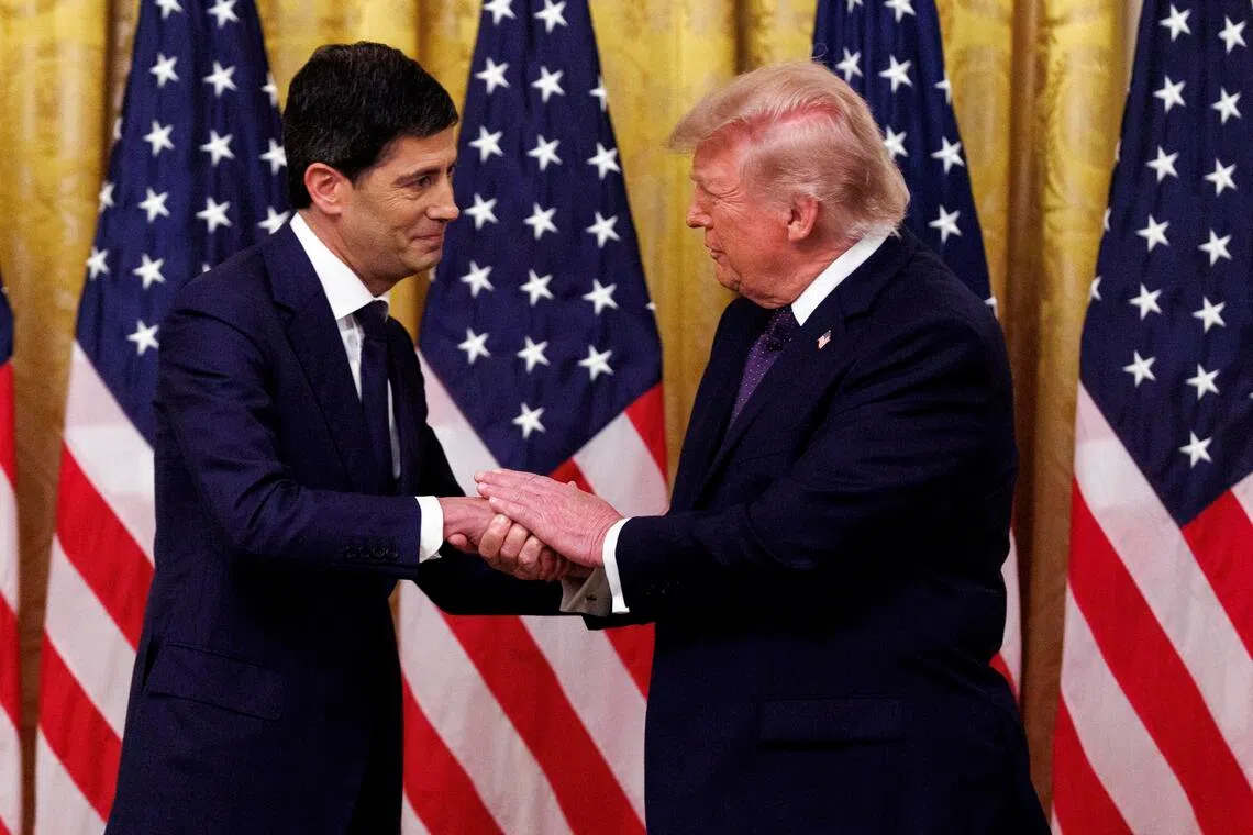 US President Donald Trump (right) shaking hands with Mr Kevin Warsh during the swearing-in of Mr Warsh as the new chairman of the Federal Reserve on May 22 at the White House.