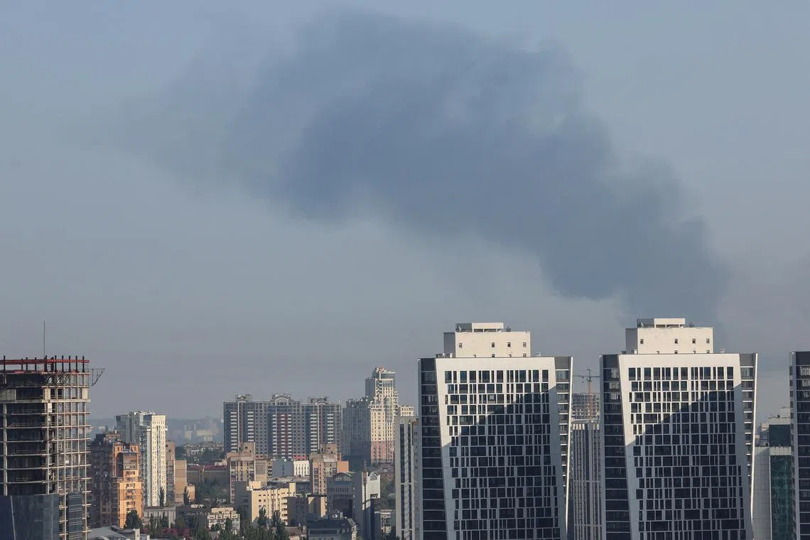 Smoke rises in the sky over the city after a Russian missile strike, amid Russia's attack on Ukraine, in Kyiv, Ukraine August 26, 2024. REUTERS/Gleb Garanich