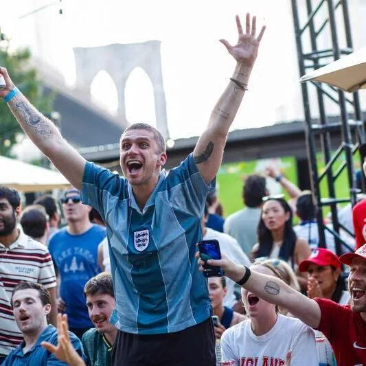 England fans react as their team scores a goal during a watch party of the World Cup quarterfinal football match between England and Norway in Brooklyn, New York, on July 11.