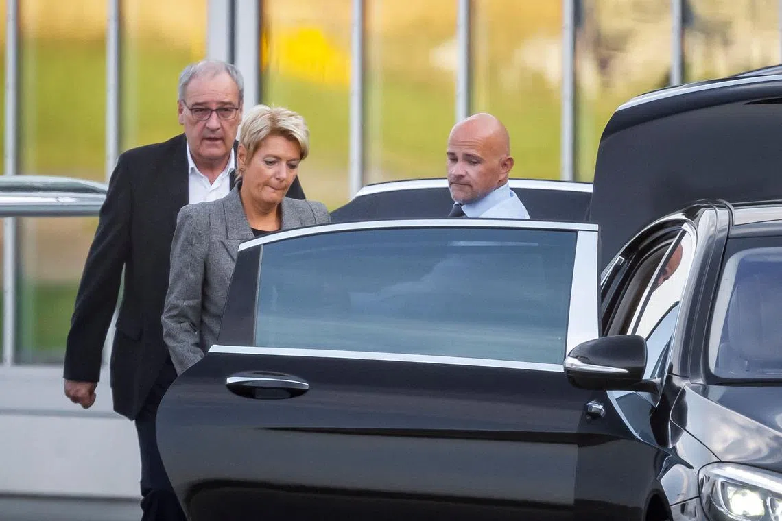 Swiss President Karin Keller-Sutter and  Economy Minister Guy Parmelin entering a limousine after arriving home from Washington on Aug 7. 
