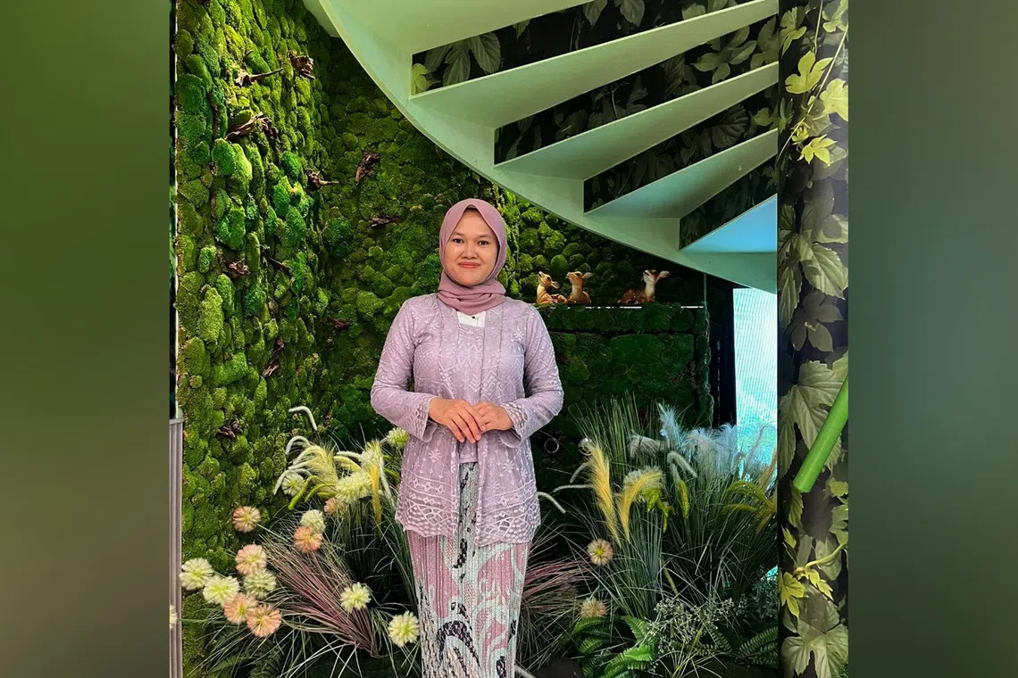 Nur Bayani, 38, took financial literacy lessons with Aidha, a charity empowering migrant domestic workers and low-income women. Despite later falling into debt after being scammed online, she overcame the setback and is now an Aidha ambassador.
