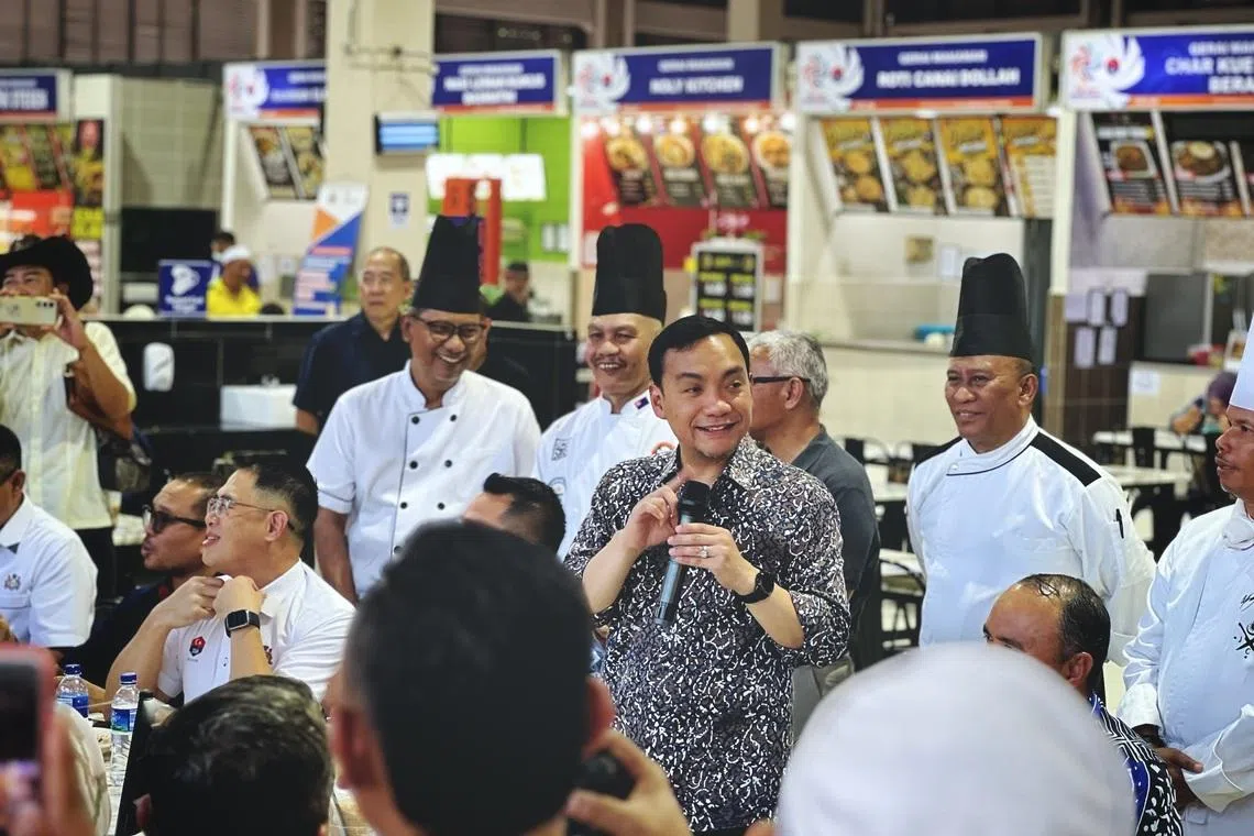 Johor Menteri Besar Datuk Onn Hafiz Ghazi giving a speech to business owners and state officials during a visit to the Medan Niaga Kampung Melayu Majidee in Johor Bahru on May 14.