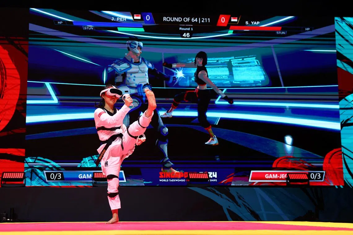 Singapore's Sherri Yap sparring against compatriot Justin Peh at the inaugural World Taekwondo Virtual Championships in Singapore.