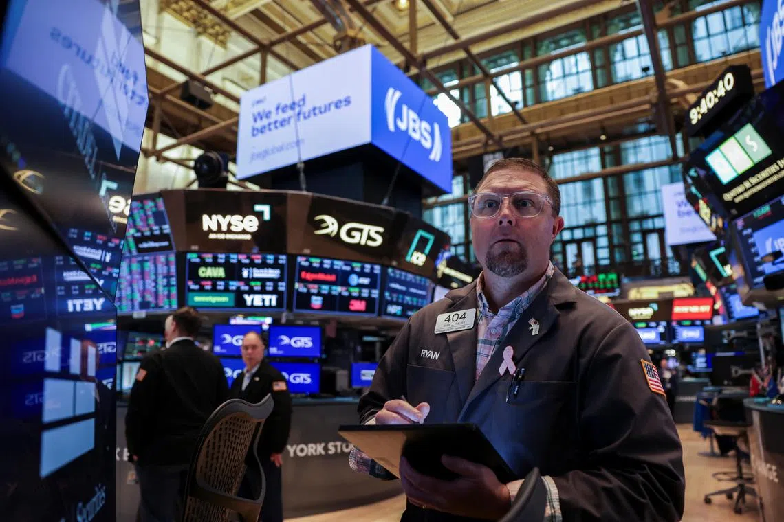 Traders working on the floor of the New York Stock Exchange, in New York City, on June 25.