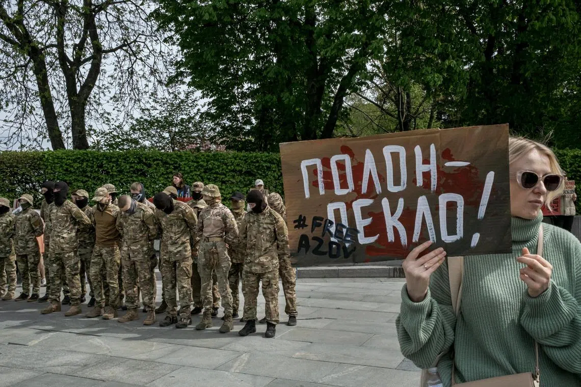 Soldiers from Ukraine’s Azov Regiment gather with supporters calling for the release of more than 900 of its soldiers held by Russia since 2022, in Kyiv, on April 14.