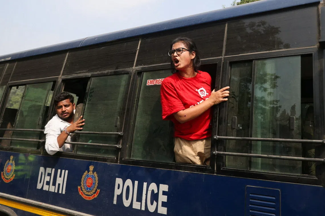 Neha Bora, National President of the All India Students' Association (AISA), shouts from a police vehicle after being detained during a protest organised by the Cockroach Janta Party (CJP) seeking the resignation of India's Chief Election Commissioner, Gyanesh Kumar, in New Delhi, India, October 10, 2026. REUTERS/Stringer