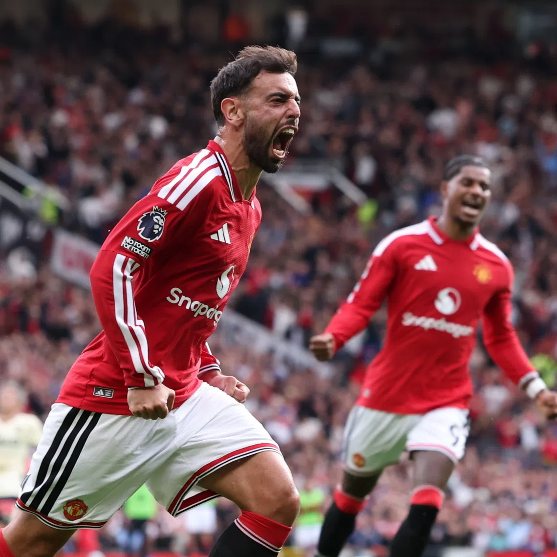 Bruno Fernandes of Manchester United celebrates scoring the 1-1 goal against Ipswich Town, in Manchester, Britain.