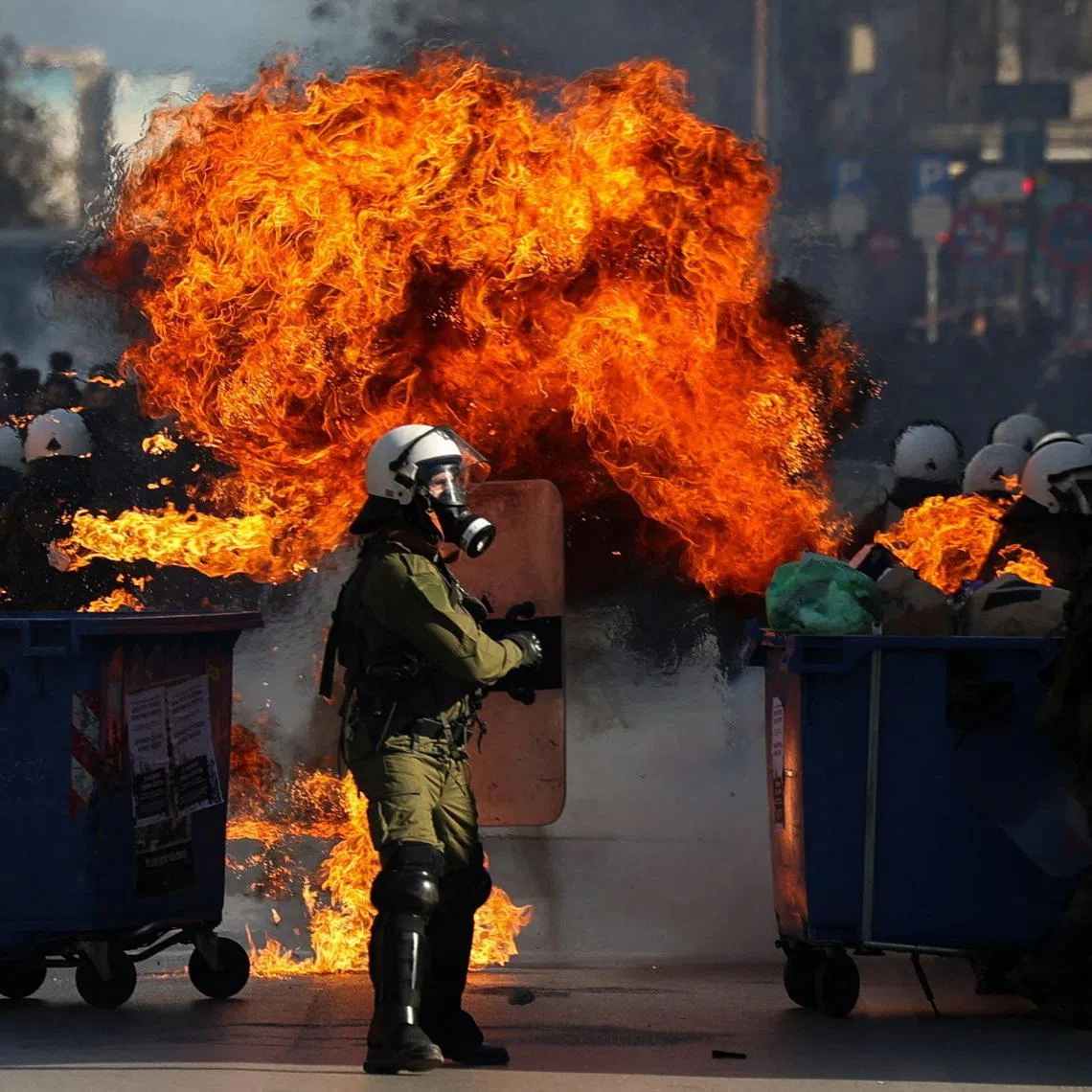 A Molotov cocktail explodes near riot police during clashes at a demonstration marking the anniversary of the 2023 deadly train crash in Tempi, the country's worst railway disaster on record, in Thessaloniki, Greece, February 28, 2026. REUTERS/Alexandros Avramidis