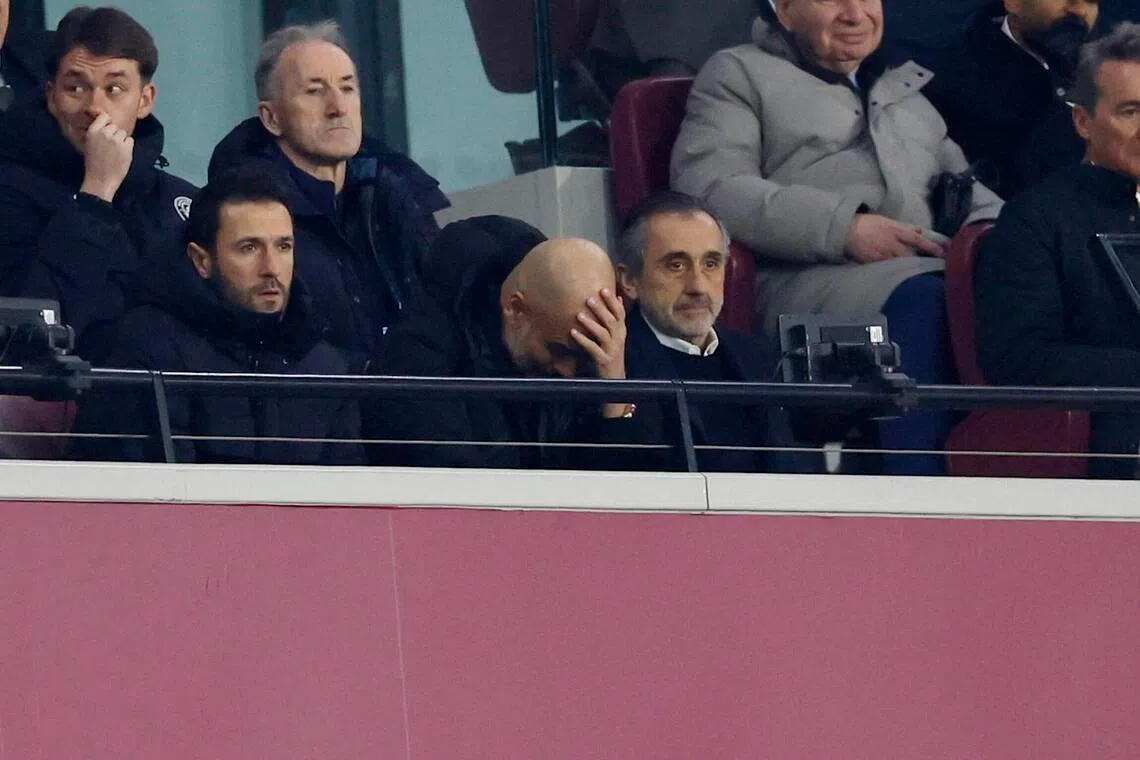 Manchester City manager Pep Guardiola shows his disappointment in the stands during his side's 1-1 English Premier League draw with West Ham United on March 14.