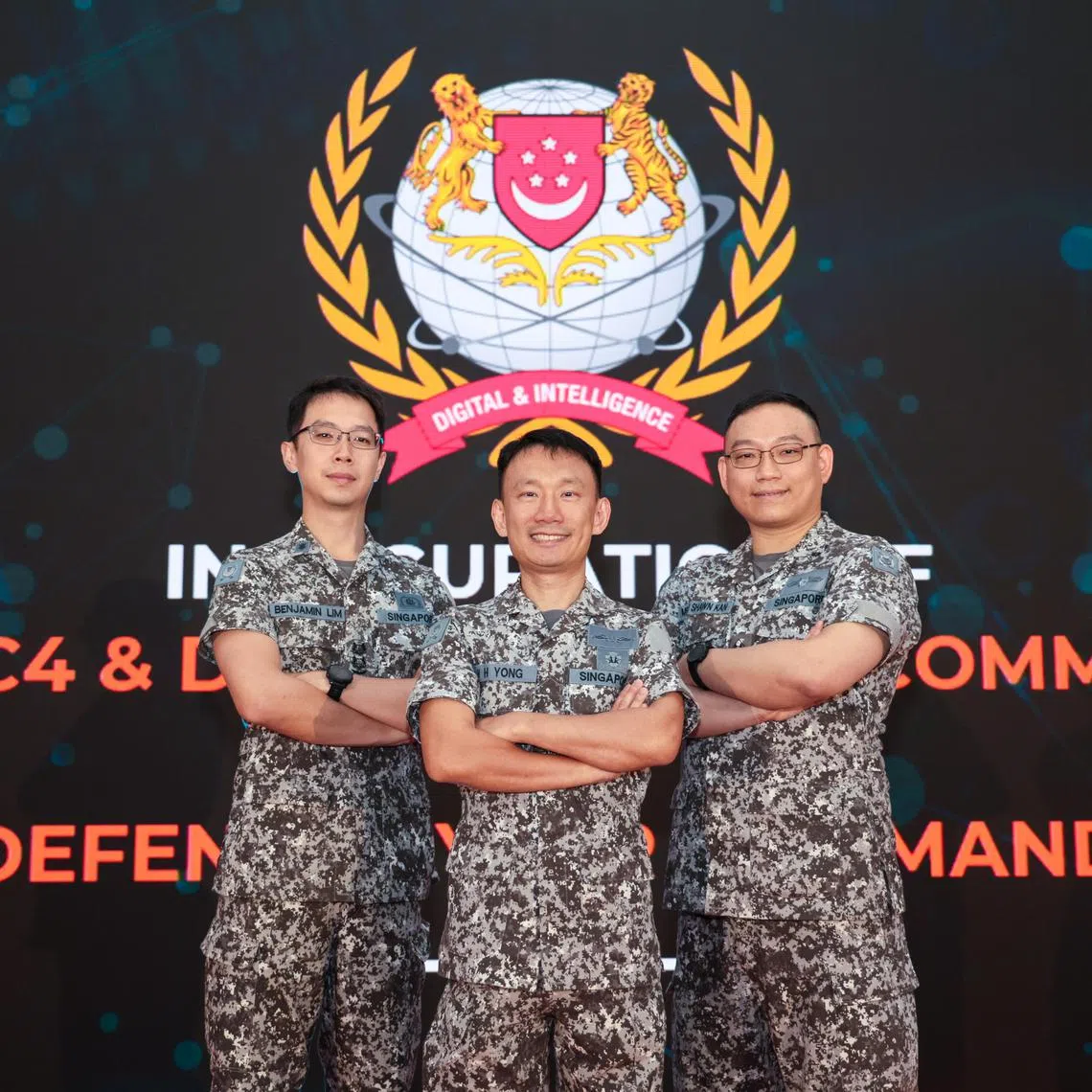 CMG20250318-RChiong01/张俊杰/马华卿/Inauguration of the Digital and Intelligence Service(DIS)' Defence Cyber Command (DCCOM) and SAF C4 & Digitalisation Command (SAFC4DC) [Hillview Camp] 

(L-R): SLTC Benjamin Lim, 39, Commander Cyber Protection Group; RADM Yong Wei Hsiung, 45, Chief of Staff-Digital and Intelligence Staff (COS-DS) and Head DIS Operations (HDO); ME6 Shawn Kan, 40, Head SAF AI Centre, seen at the inauguration ceremony of the Digital and Intelligence Service (DIS)' Defence Cyber Command (DCCOM) and SAF C4 & Digitalisation Command (SAFC4DC) on March 18, 2025.