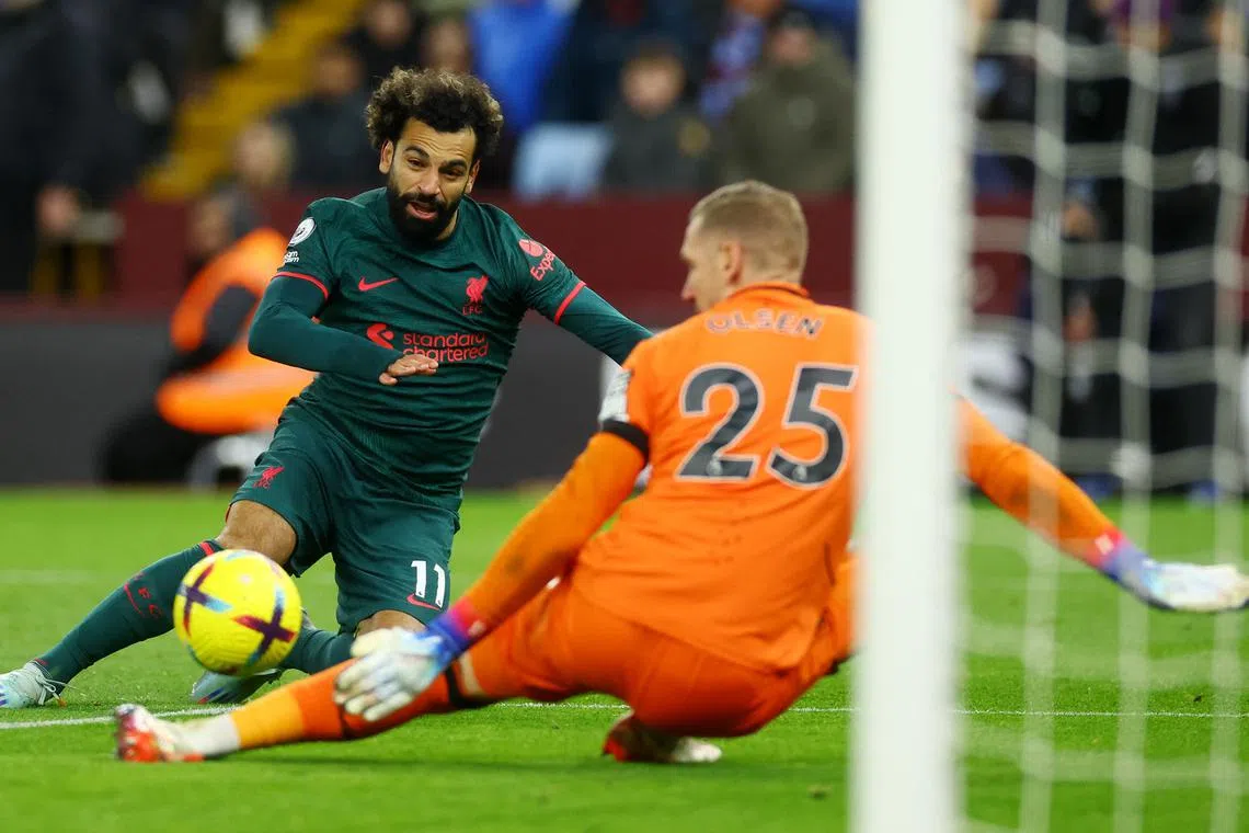 Aston Villa's Robin Olsen saves from Liverpool's Mohamed Salah.