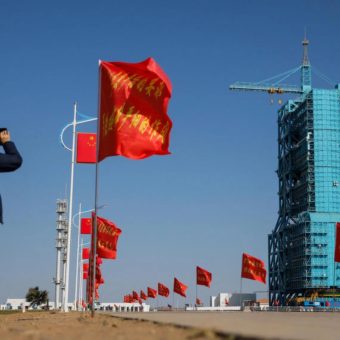 A successful reusable rocket test would require the rocket's large lower section, known as first stage or booster, to be landed and recovered after launch.