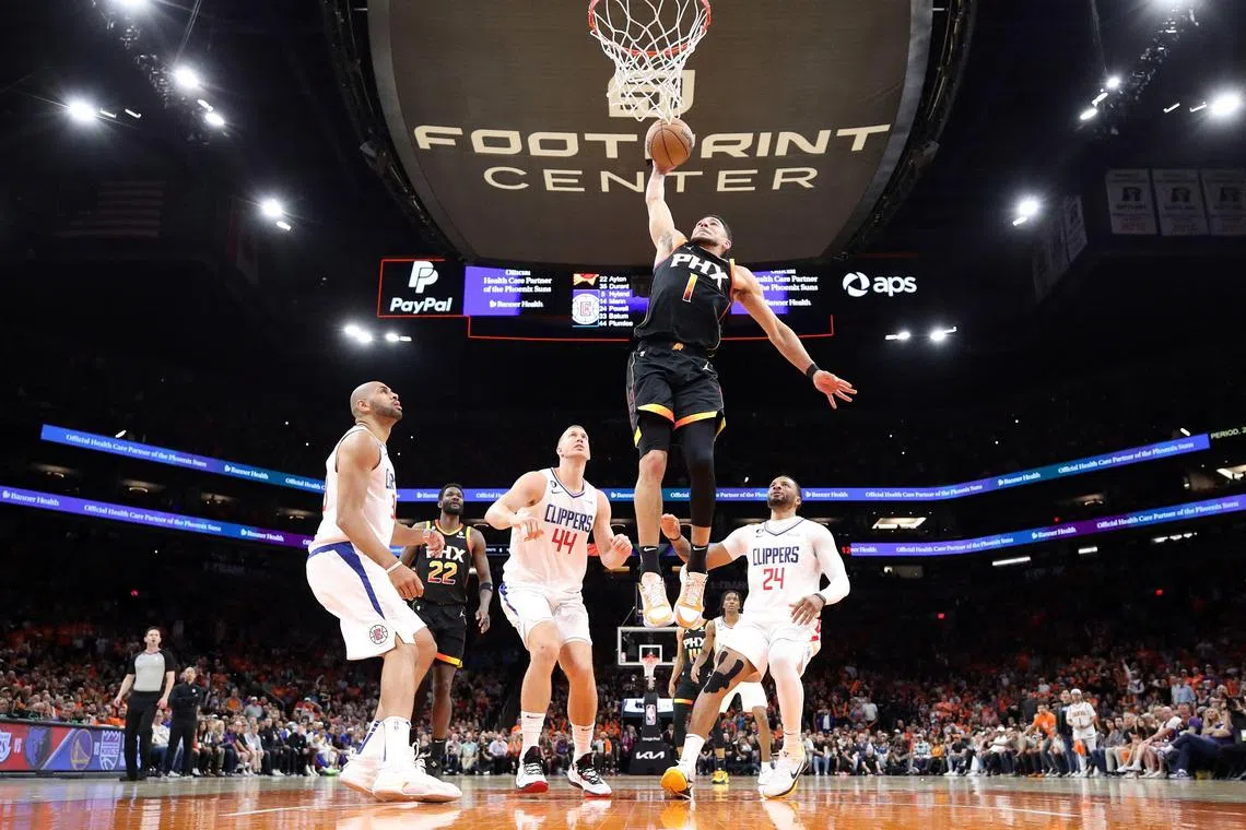 Devin Booker of the Phoenix Suns dunks the ball during the third quarter against the Los Angeles Clippers in Game 5 of their NBA play-offs.