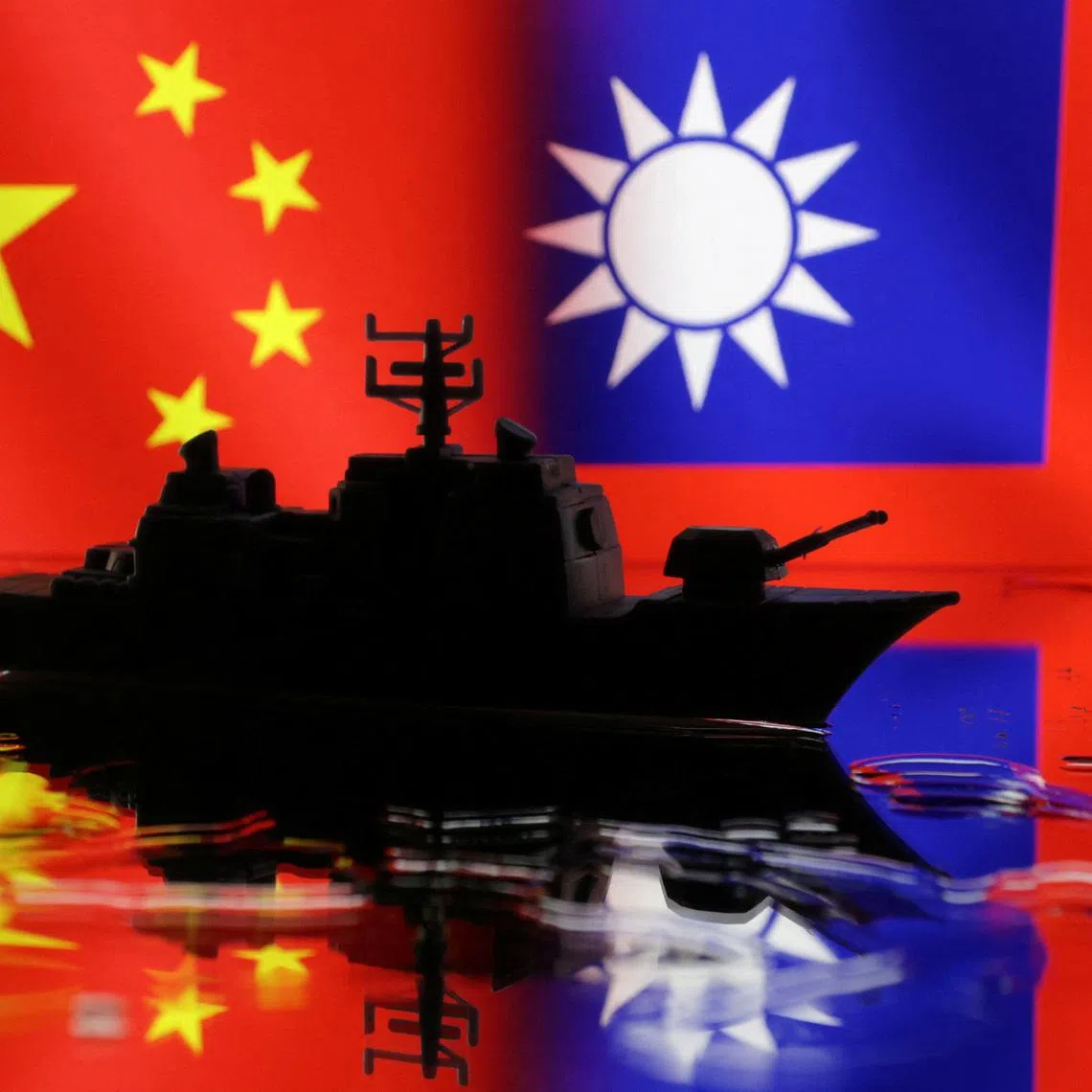 A Navy miniature is seen in front of displayed Chinese and Taiwanese flags in this illustration taken, April 11, 2023. REUTERS/Dado Ruvic/Illustration