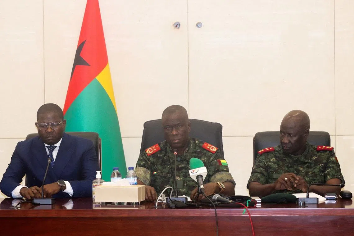 FILE PHOTO: From L-R, Guinea-Bissau's Prime Minister Ilidio Vieira Te, transitional president Major-General Horta Inta-a and Major-General Tomas Djassi, chief of staff of the Armed Forces, attend a press conference in Bissau, Guinea-Bissau, December 19, 2025.  REUTERS/Delcyo Sanca/File Photo