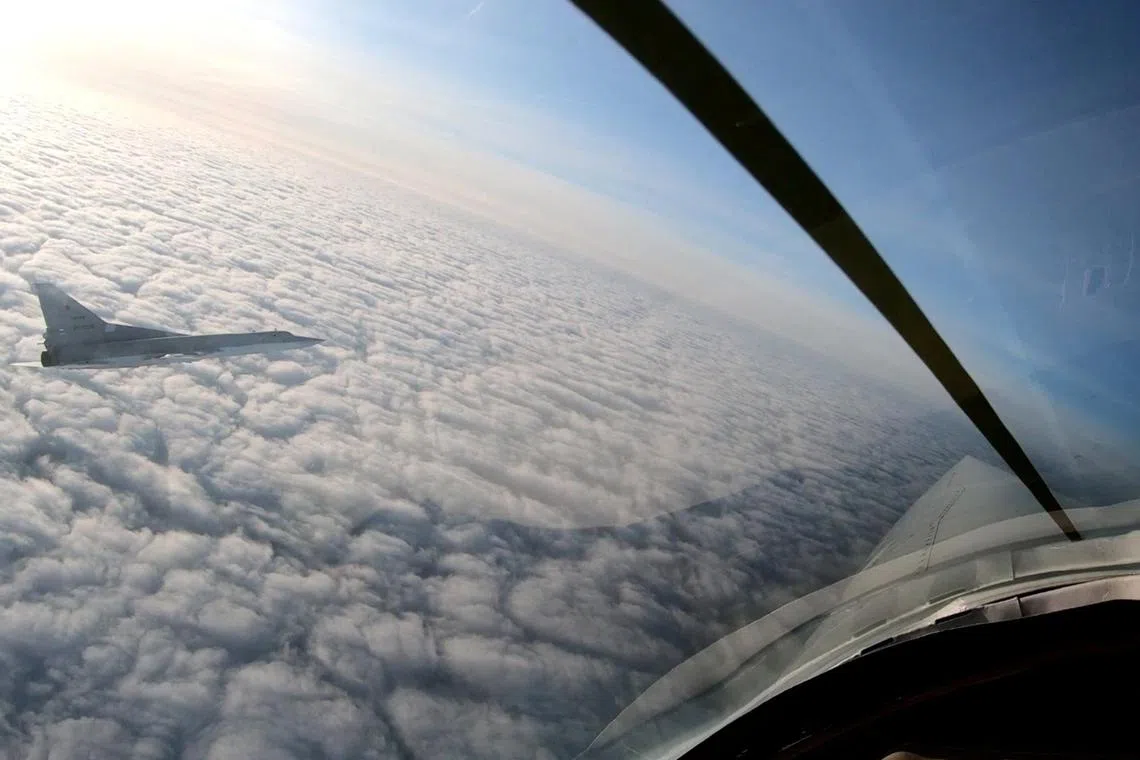 A Russian Tu-22M3 bomber performs a flight over neutral waters in the Sea of Japan.