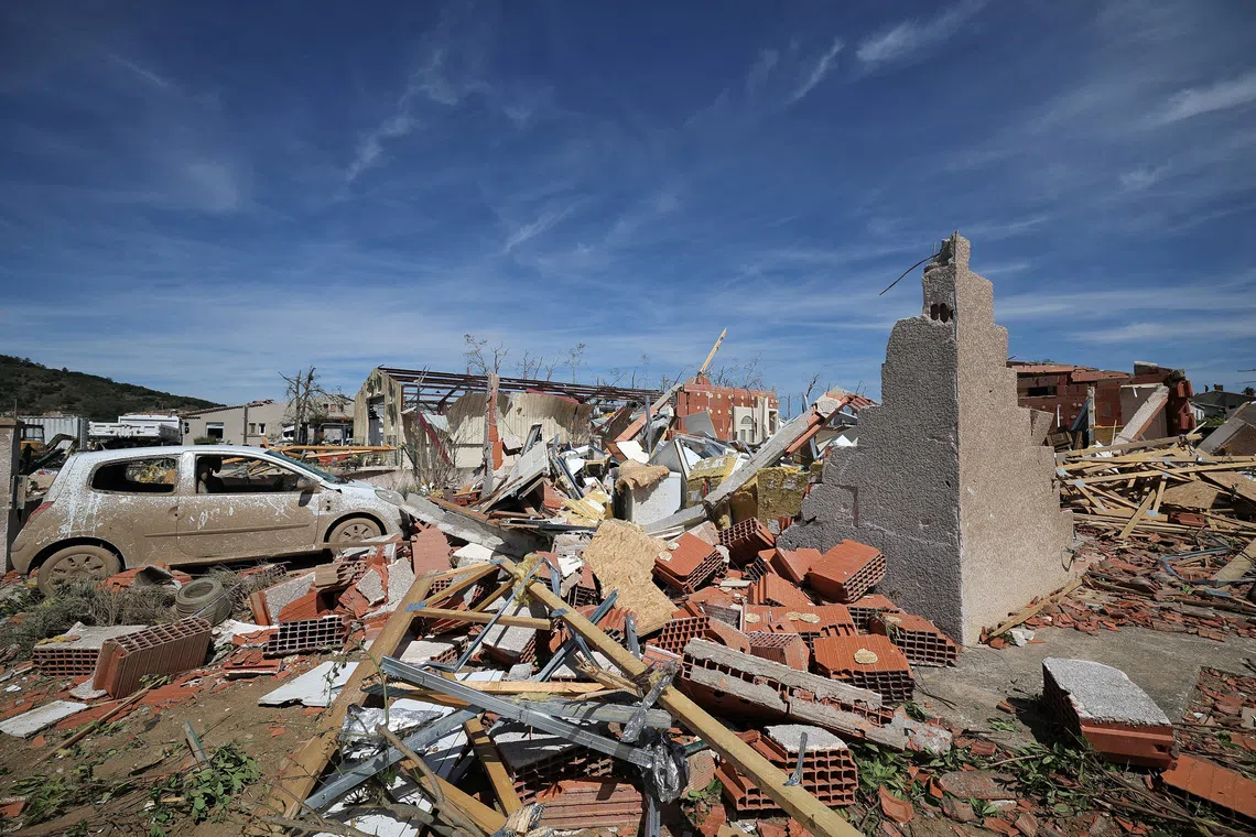View of a damaged car and debris from destroyed houses a day after a tornado struck the village of Pomas, near Carcassonne, in the Aude department, southern France, August 25, 2026. REUTERS/Manon Cruz