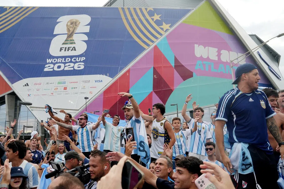 Soccer Football - FIFA World Cup 2026 - Semi Final - England v Argentina - Fans gather in Atlanta - Atlanta, Georgia, U.S. - July 15, 2026 Argentina fans celebrate in the fan festival during the match REUTERS/Megan Varner